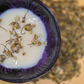 bowl of milk with chamomile flowers